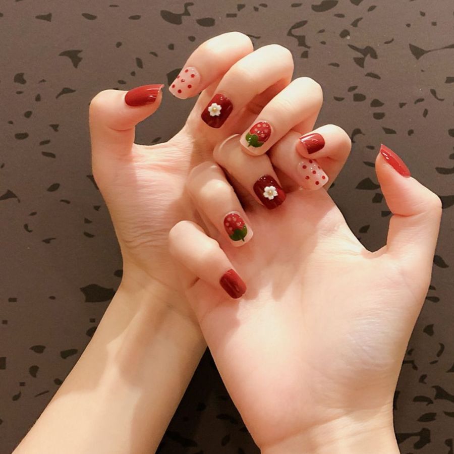 Hand-painted strawberry nail art by Bluerose Natural Nail